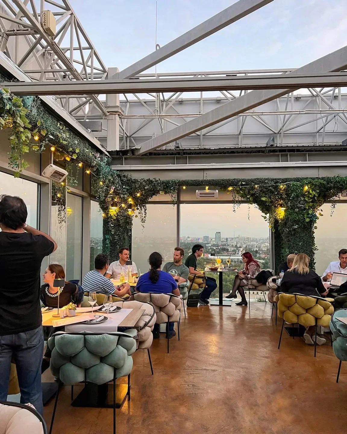 Dining at 18 Lounge in Bucharest with cityscape view, stylish design and ambiance.