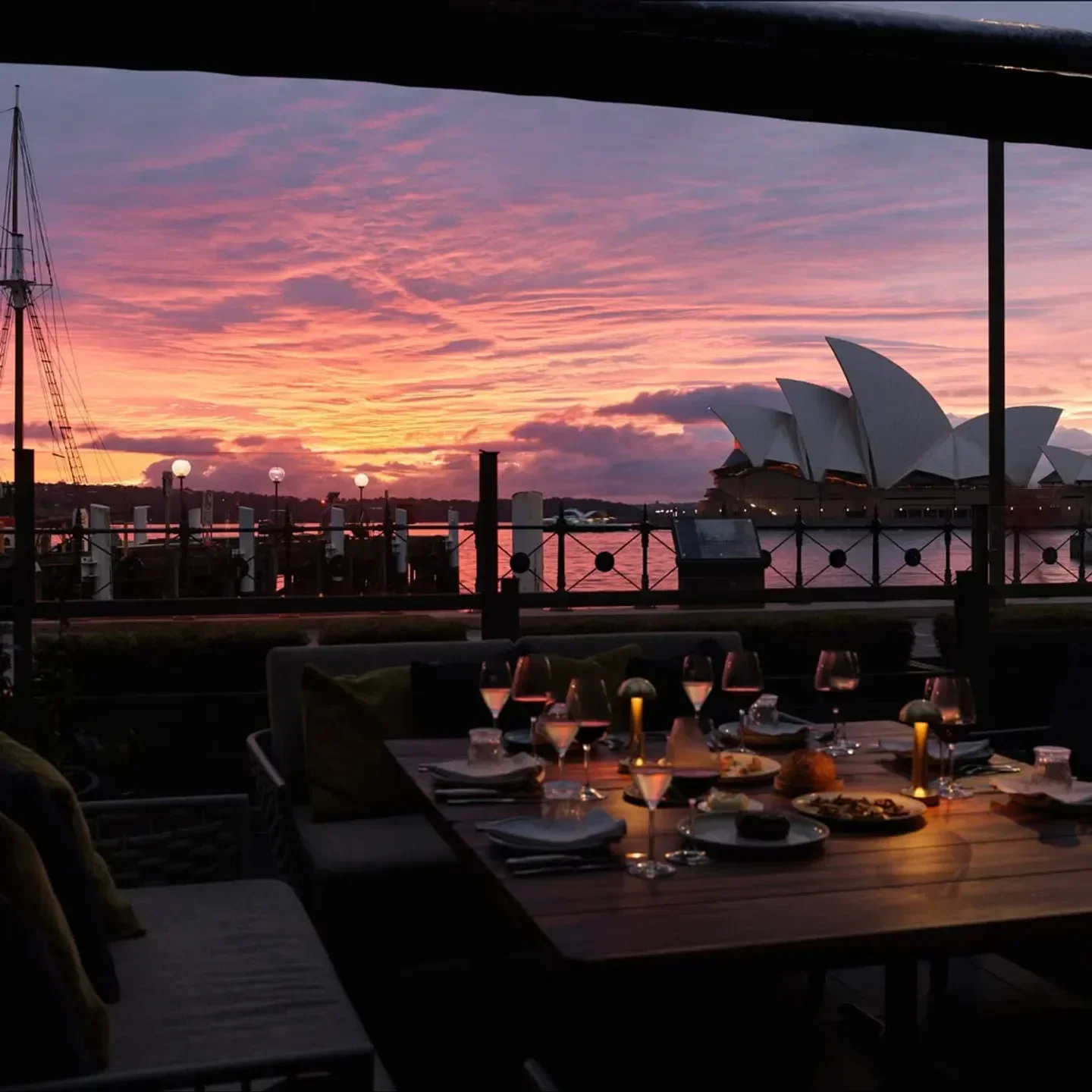Dining at 6HEAD Sydney with the Opera House at sunset with pink sky