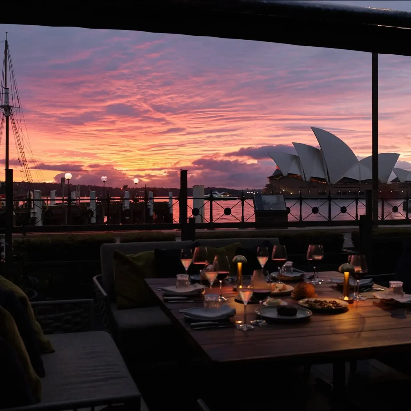 Dining at 6HEAD Sydney with the Opera House at sunset with pink sky