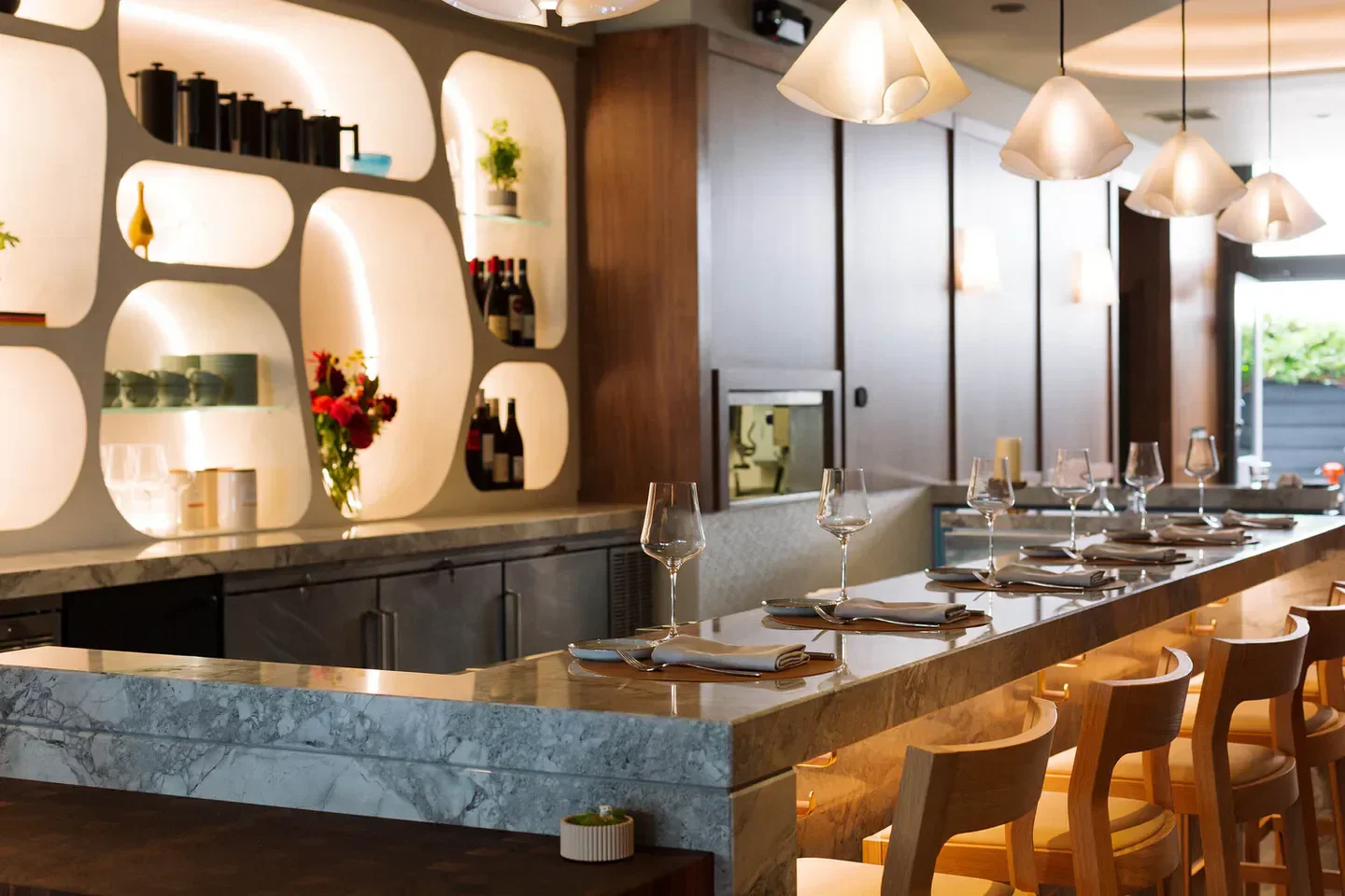 Interior of 7 Adams restaurant in San Francisco, featuring bar with seating and glassware.