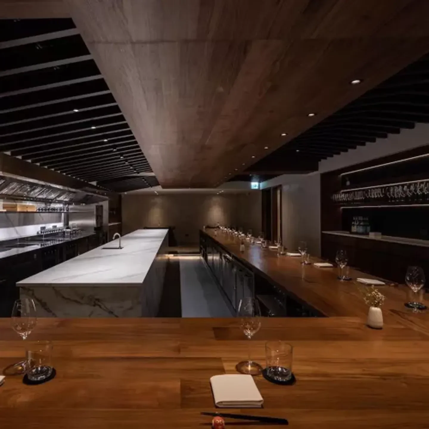 Elegant dining space at Ad Astra in Taipei, featuring a long wooden table