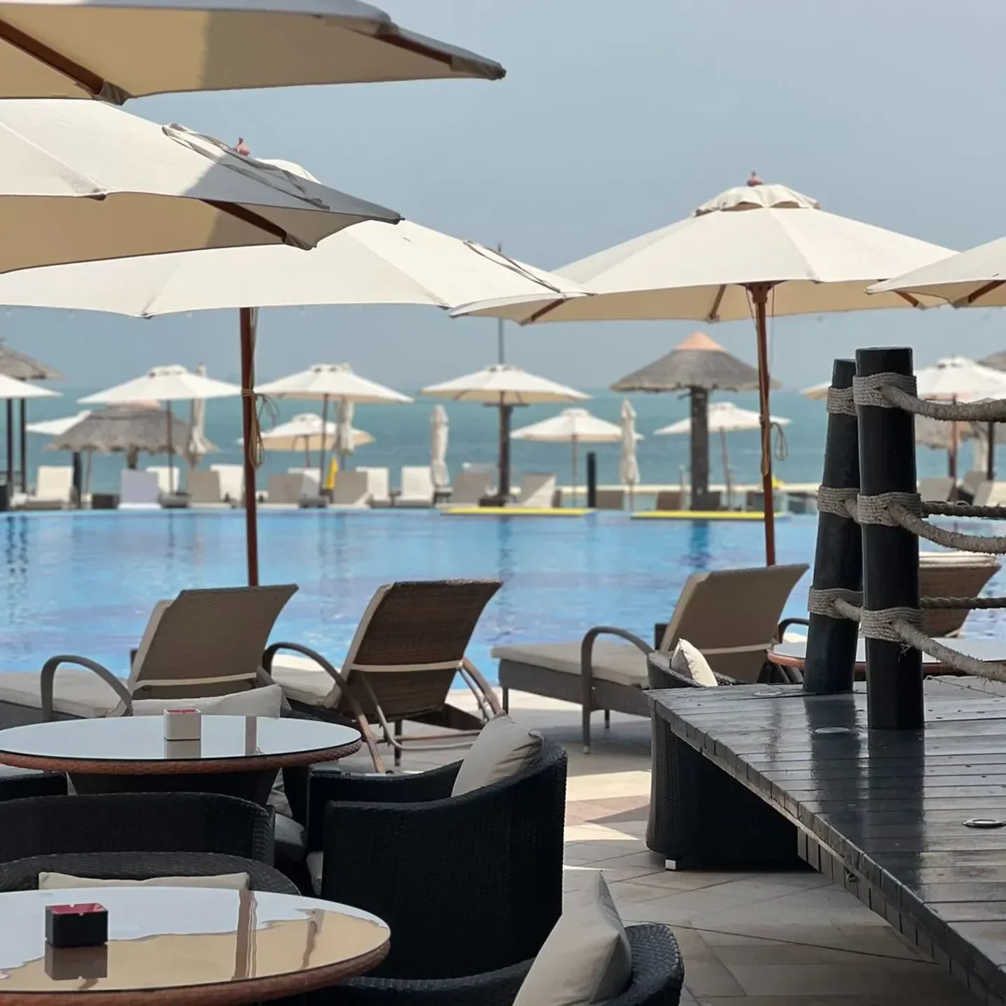 Beach club pool and umbrellas at Al Maya Island Resort, Abu Dhabi