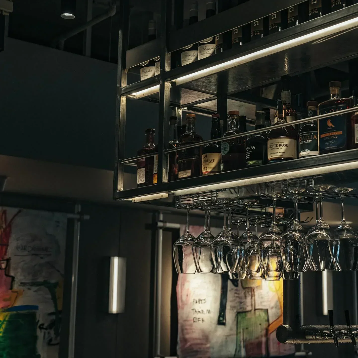 Interior bar with hanging glasses at Alfie's restaurant in Sydney.