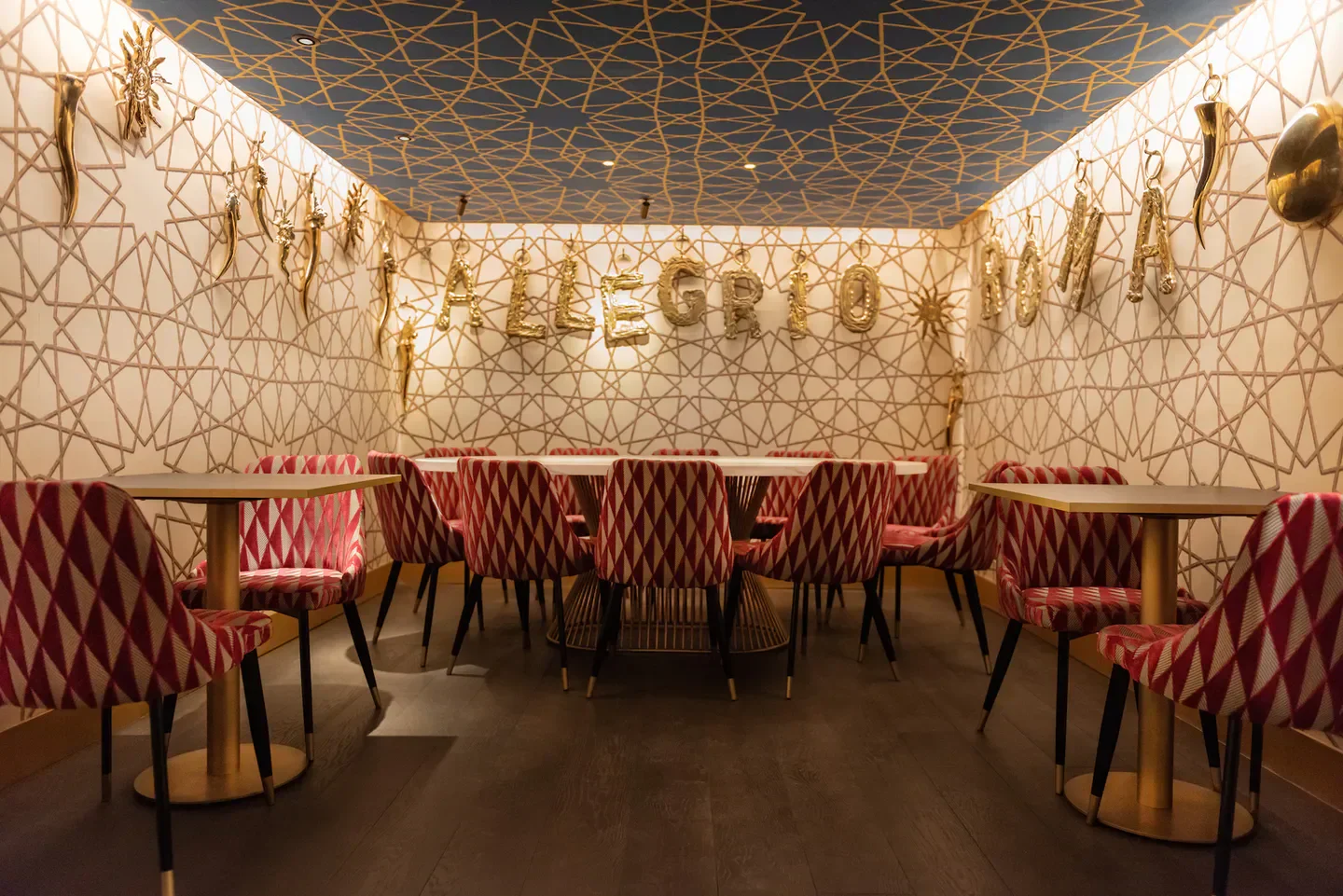 Elegant dining area at Allegrío restaurant in Rome, featuring stylish decor and seating.