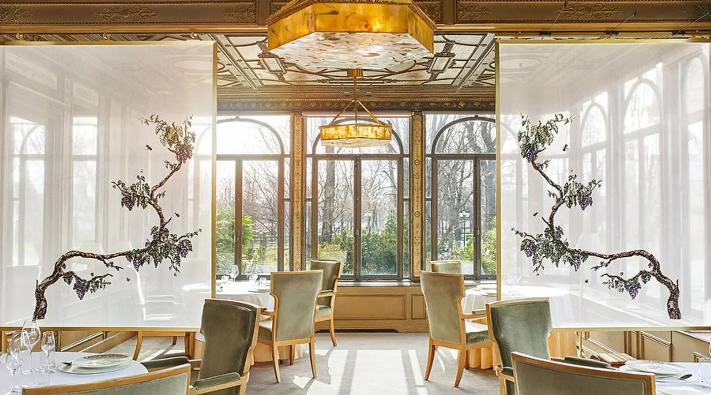 Elegant dining room at Alléno Paris Au Pavillon Ledoyen in Paris with botanical art