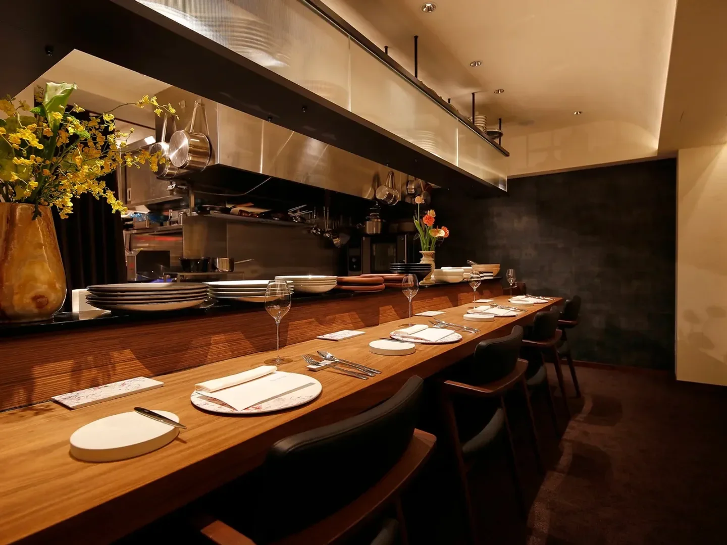 Interior of amarantos restaurant in Tokyo, showcasing elegant dining and open kitchen