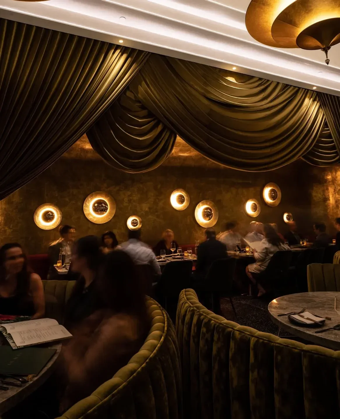 Interior of Animae restaurant in San Diego, with soft lighting and dining ambiance.