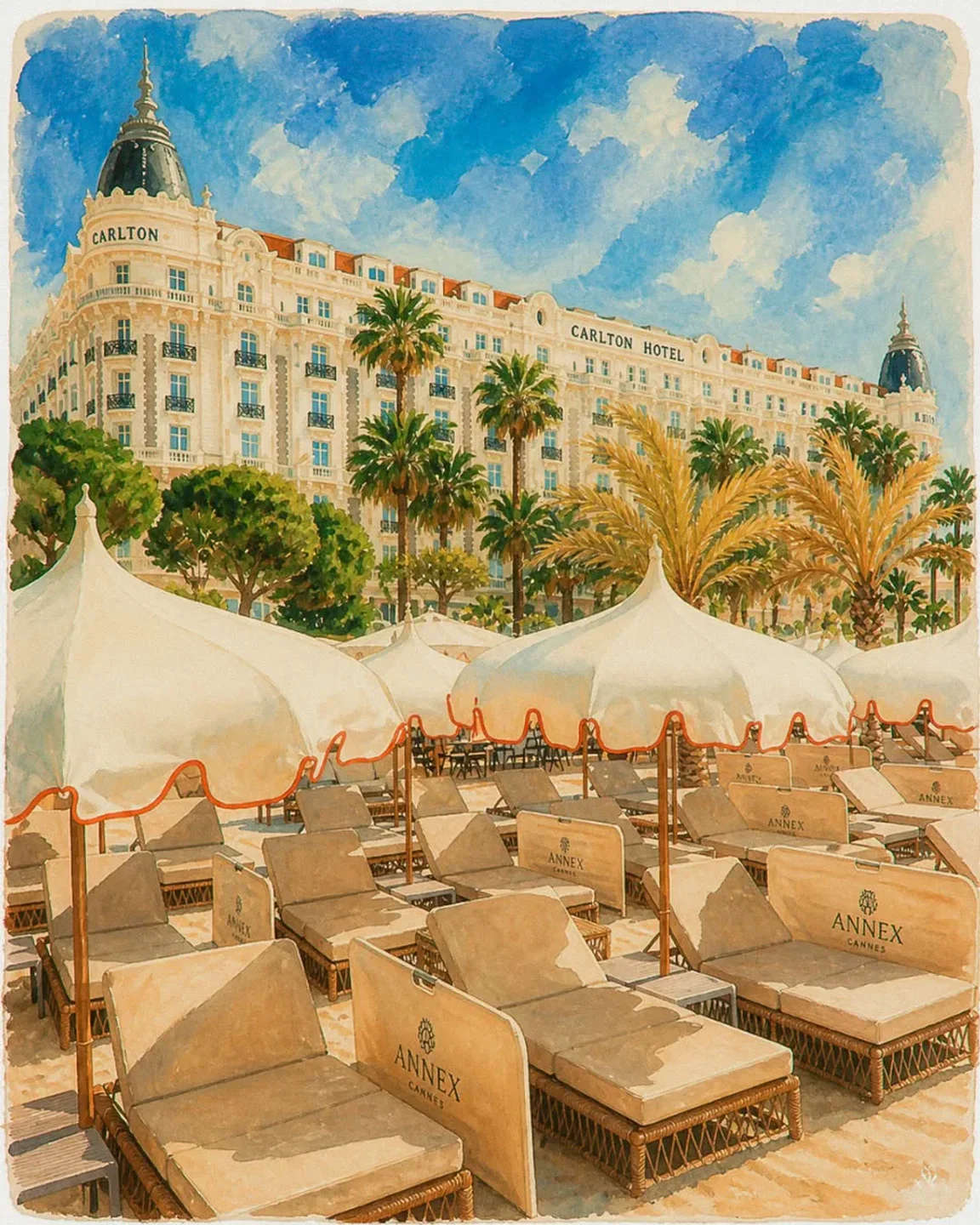 Annex Beach Cannes luxury loungers and umbrellas set against the iconic Carlton Hotel on a sunny day.
