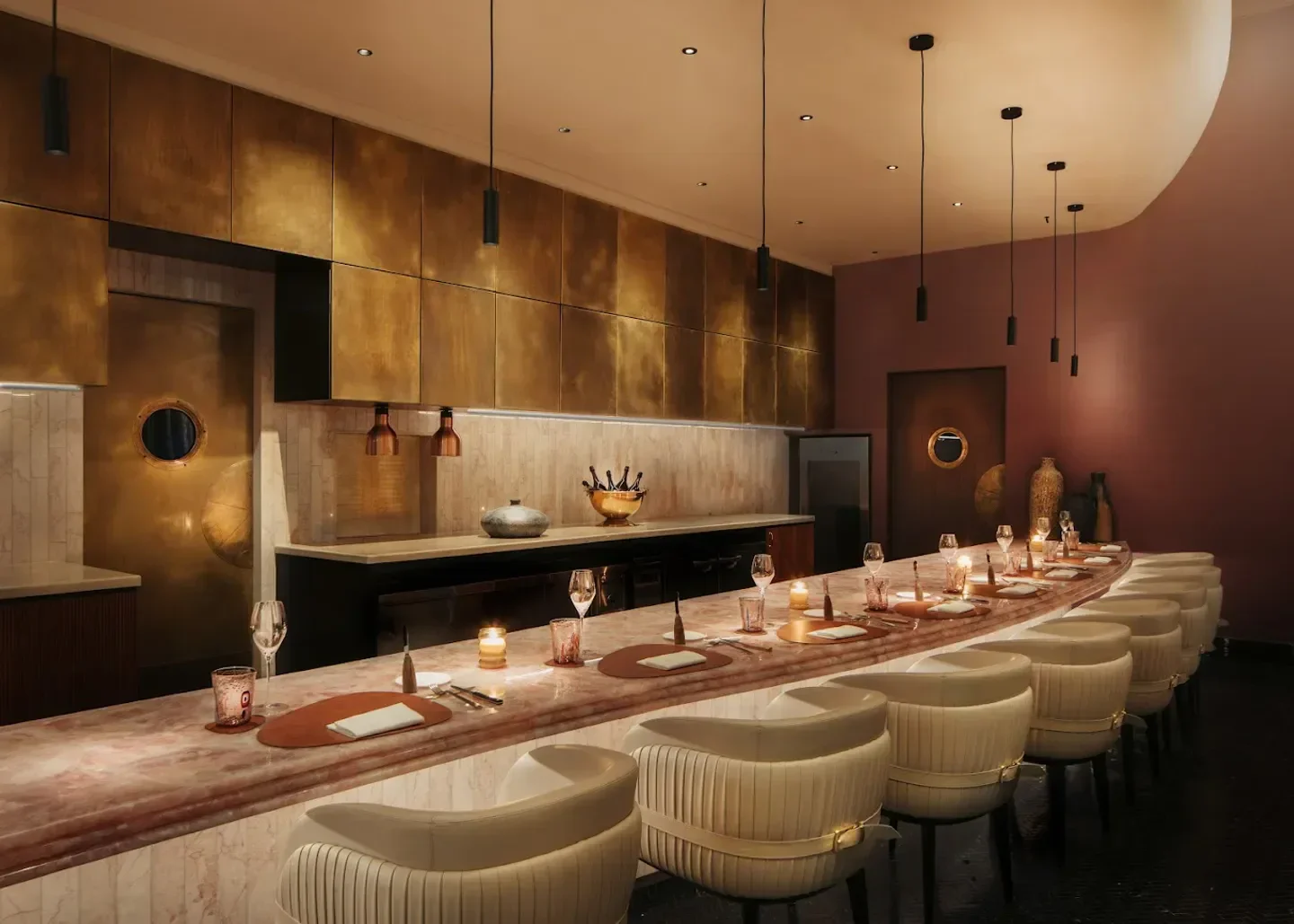 Interior of Araya restaurant in Singapore, featuring marble bar and modern design.