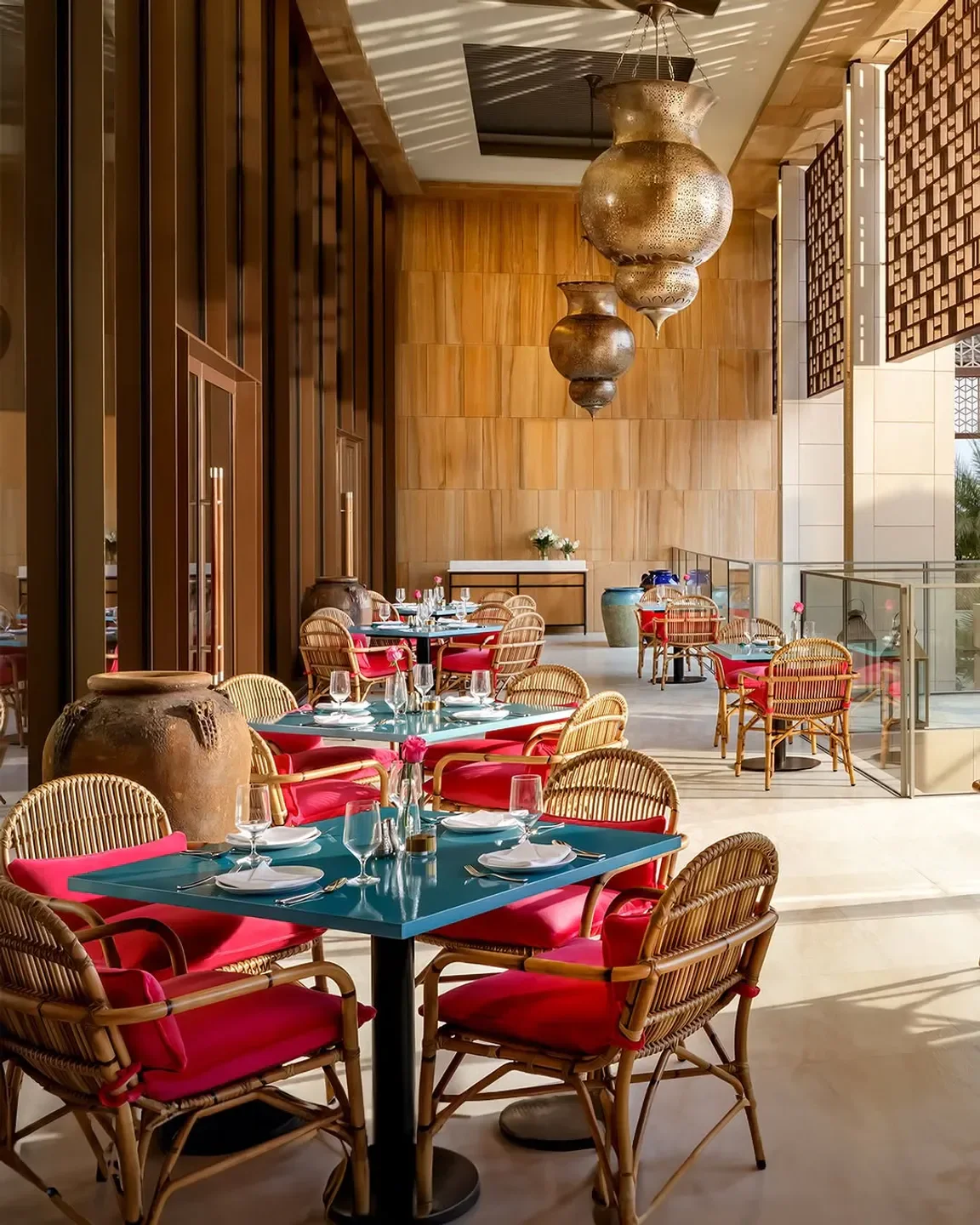 Interior of Ariana's Persian Kitchen in Dubai: tables set for dining, stylish decor.