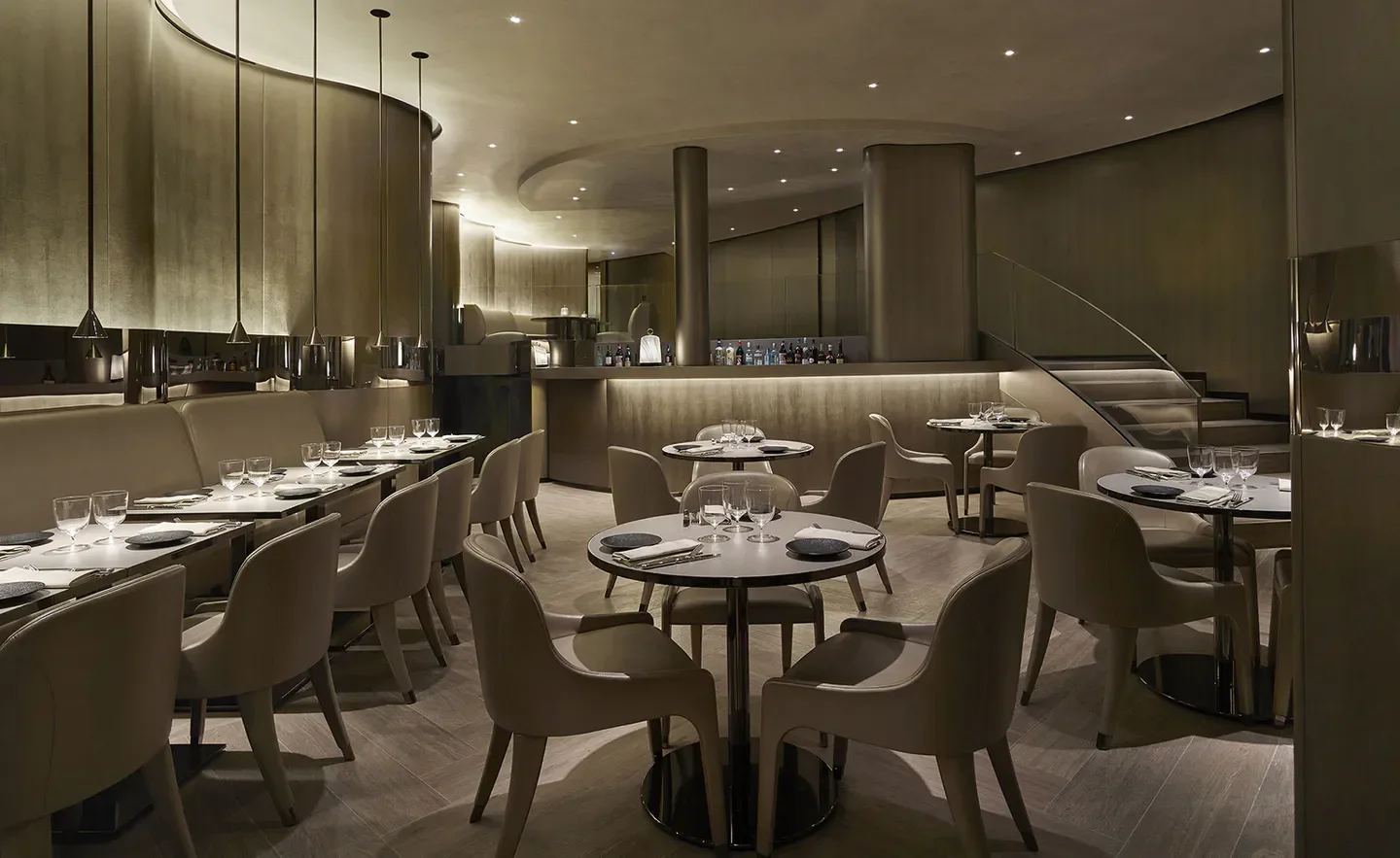 Elegant interior of Armani Ristorante in Paris, featuring modern design and dining tables.