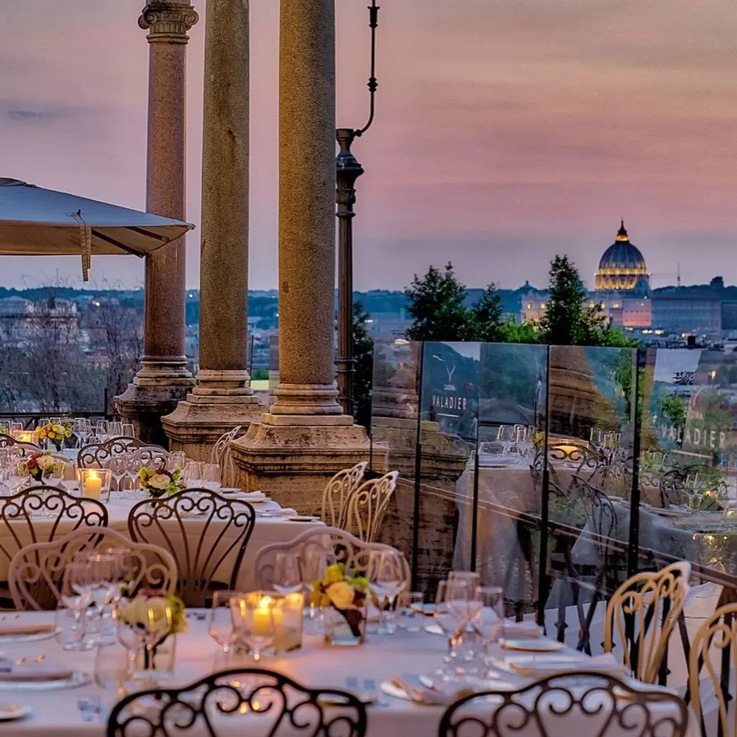 Romantic evening at Aroma restaurant in Rome with views of the city skyline.