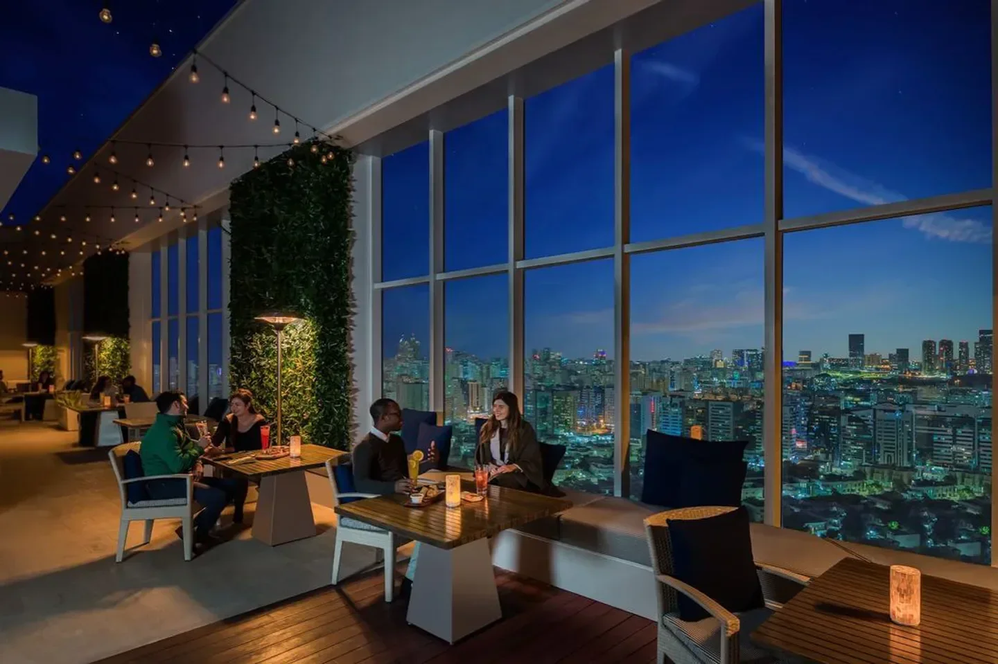 Dining at AT25 restaurant in Abu Dhabi with stunning city skyline views at night