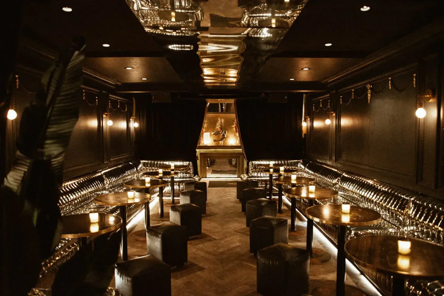 Interior of Atwater Cocktail Club in Montreal, featuring candlelit tables and a luxurious design.