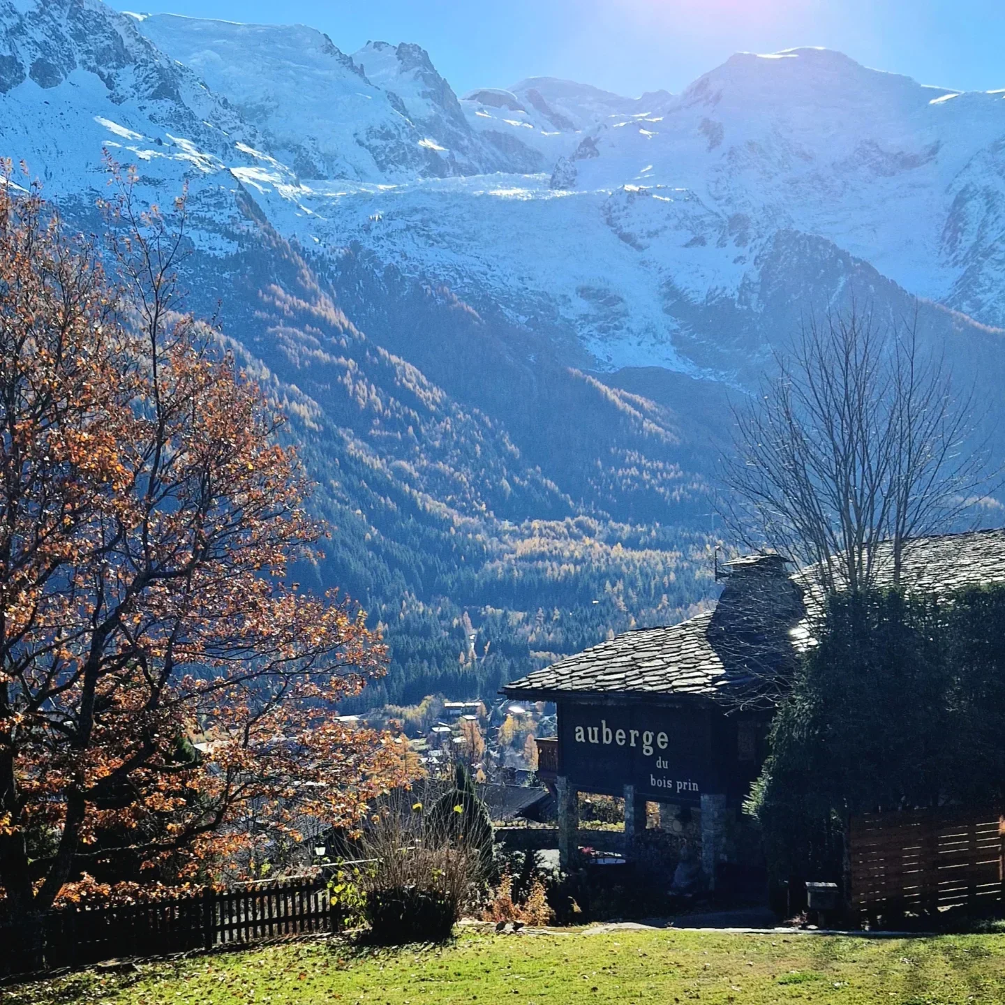 Scenic view of Auberge du Bois Prin in Chamonix with mountain backdrop and lush landscape.