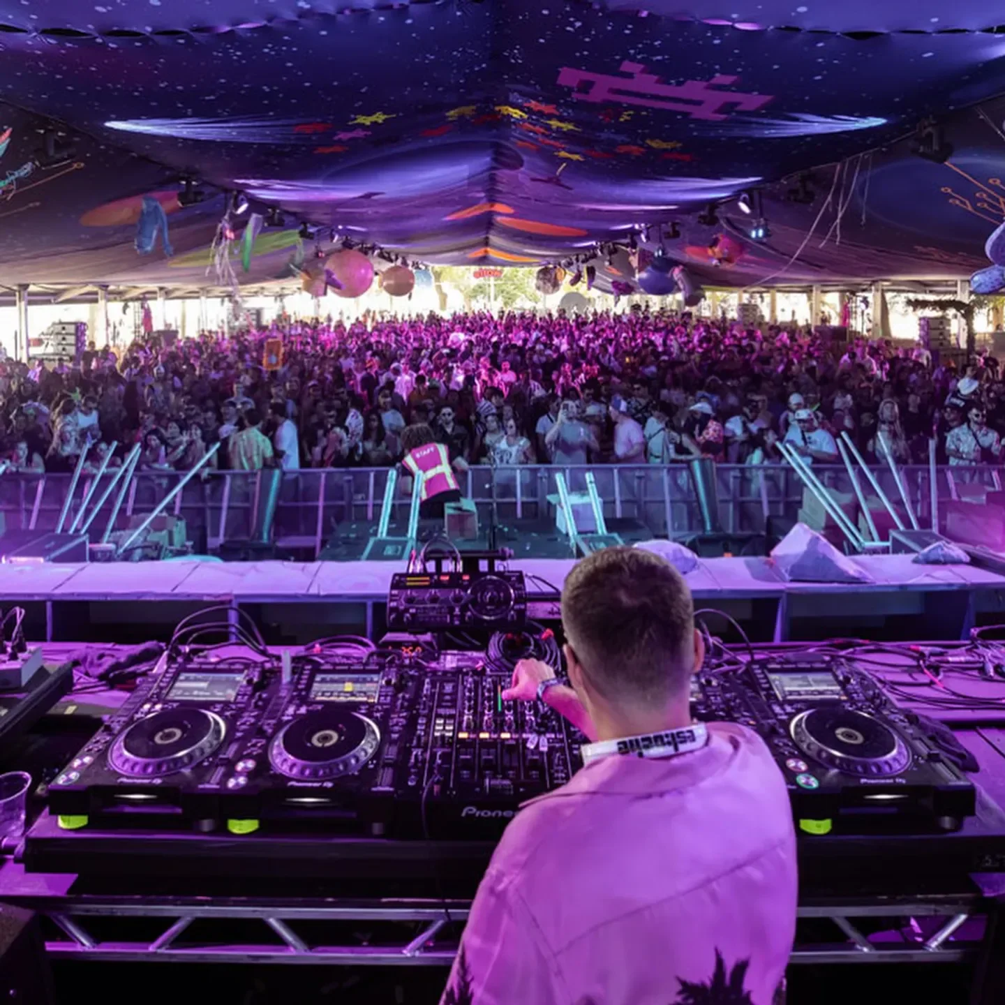 DJ performing at Audio Discotech nightclub in San Francisco with a large crowd.