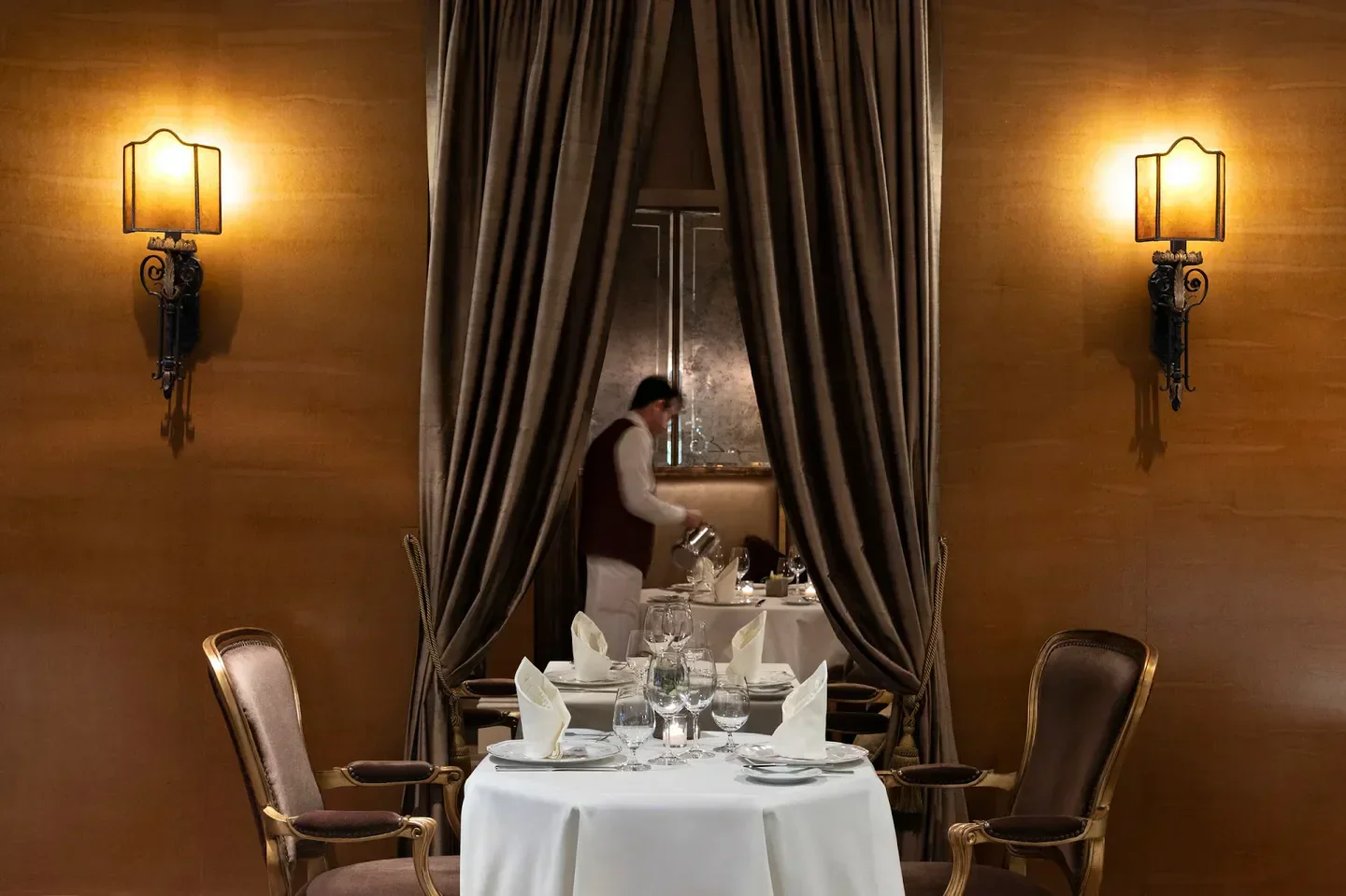 Elegant dining room at Bacchus Restaurant & Lounge in Vancouver, with waiter service.