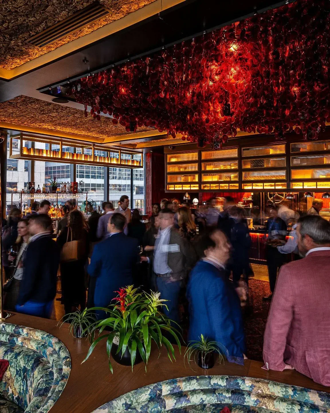 Busy evening at Bar Mar in Chicago, with a decorative red ceiling and crowd.