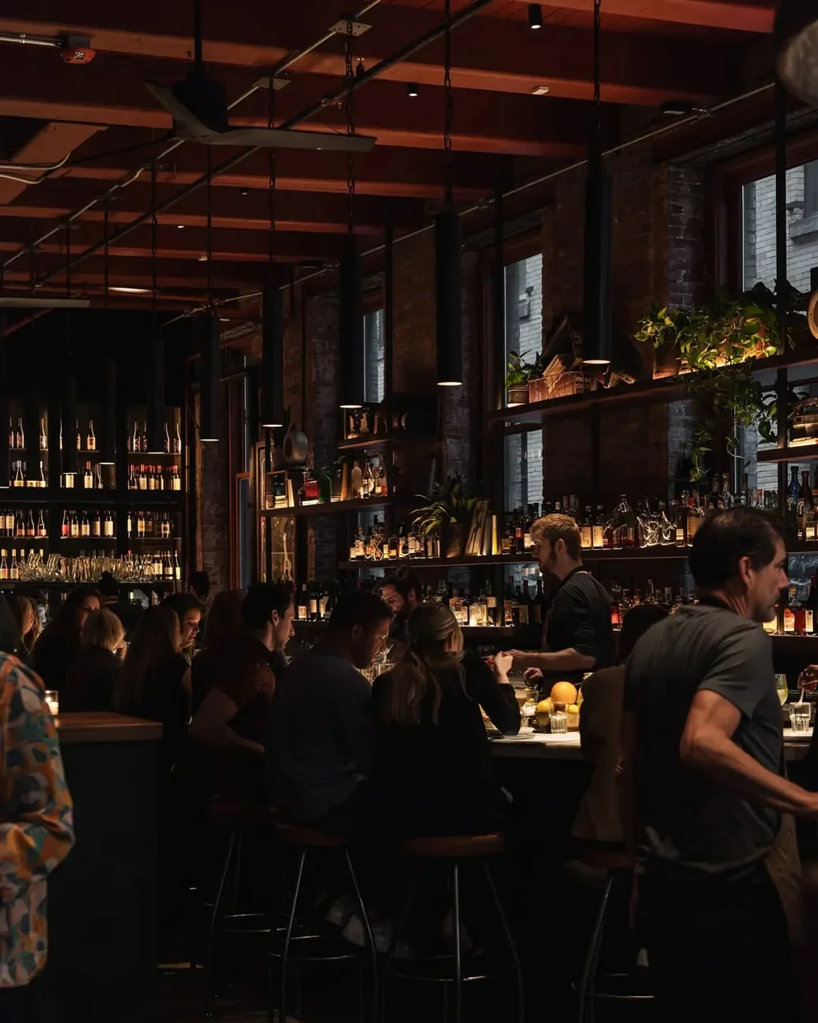 Interior of Barcelona Wine Bar - Atlanta, with patrons at the bar in Atlanta.