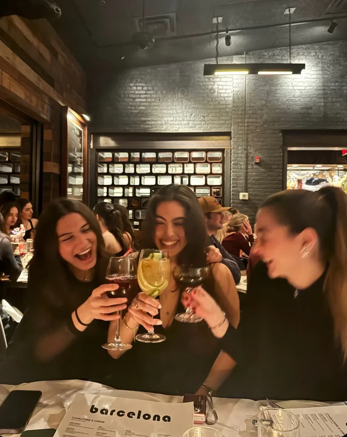 Friends enjoying drinks at Barcelona Wine Bar - Washington D.C., a restaurant in Washington.