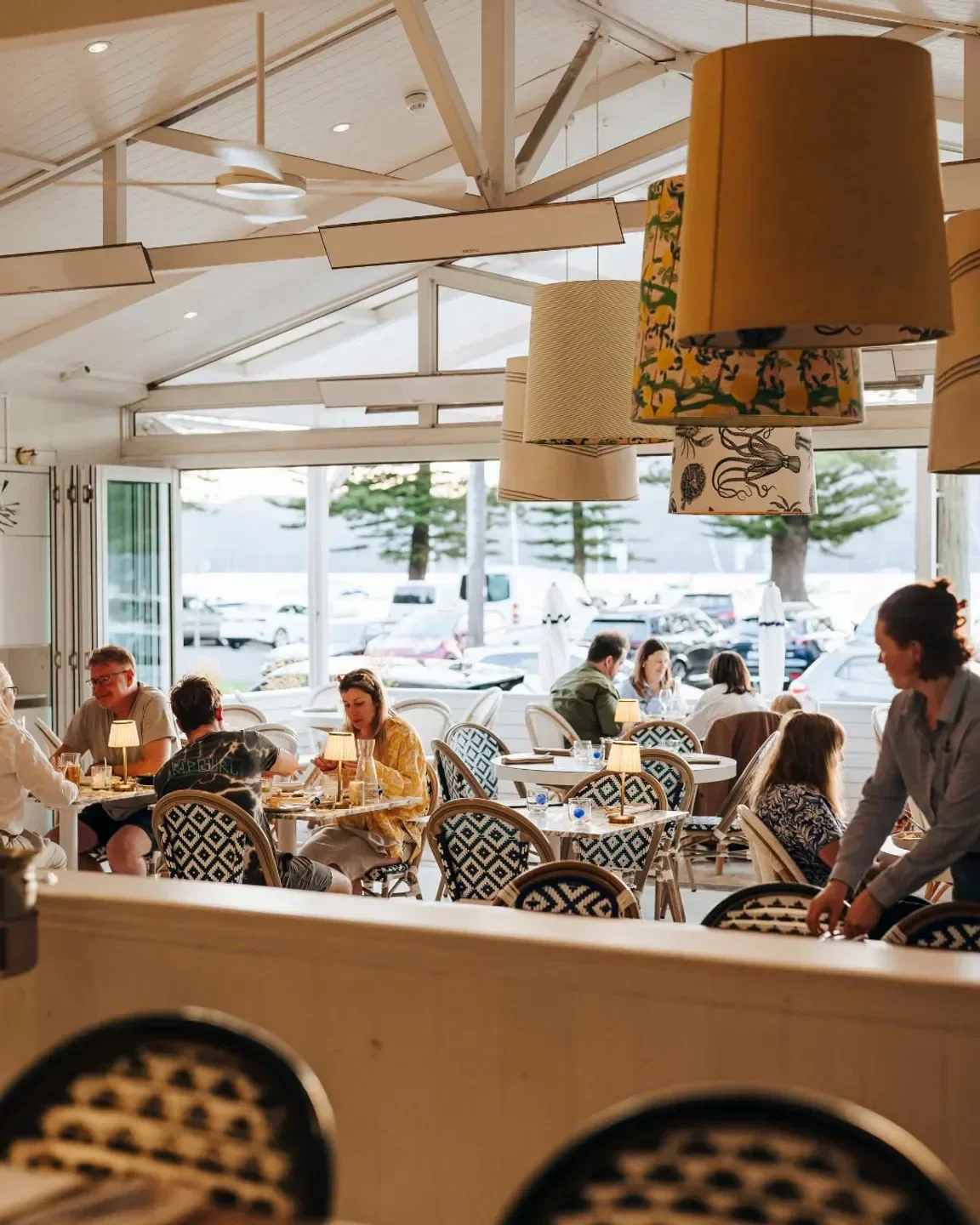Interior of Barrenjoey House restaurant in Sydney, featuring stylish decor and diners.