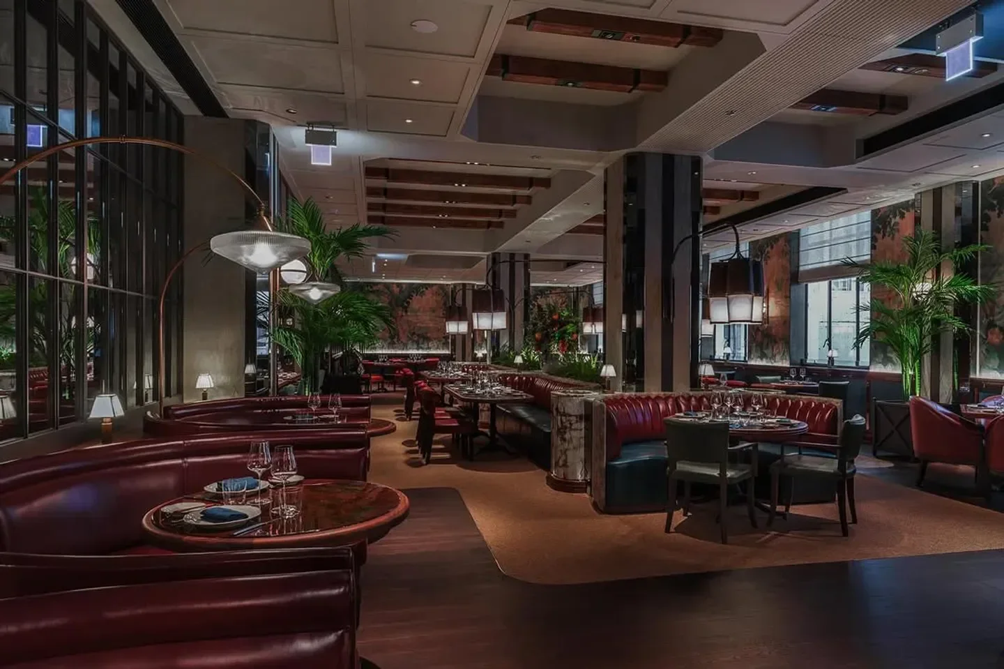 Elegant dining area at Bâtard restaurant in Hong Kong with stylish booth seating.