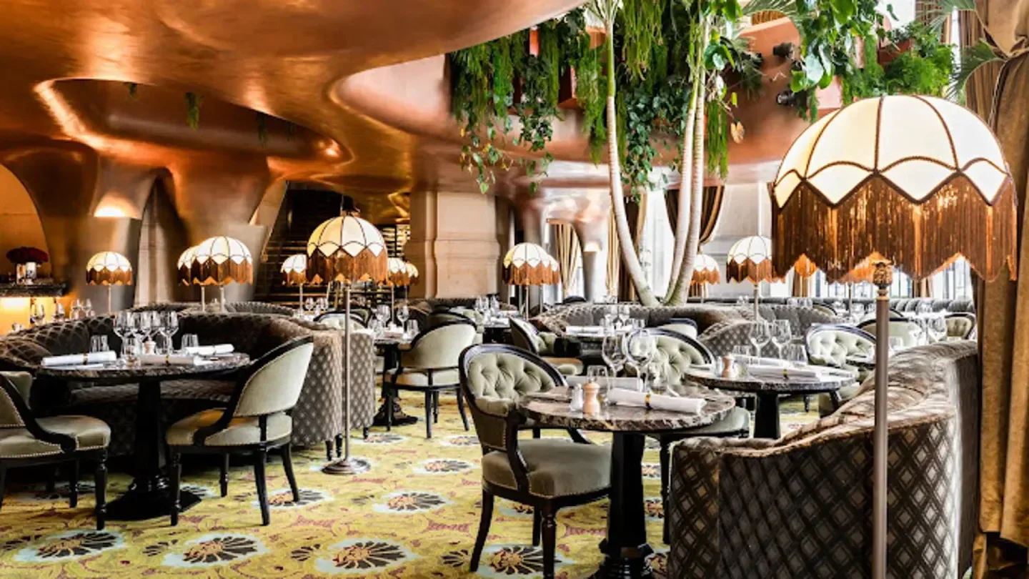 Elegant interior of BEAUCOCO restaurant in Paris, with stylish lamps and seating.