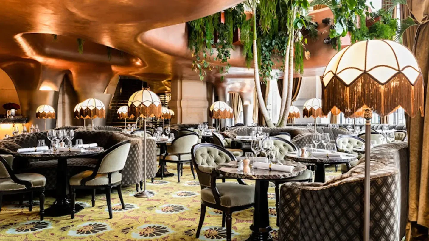 Elegant interior of BEAUCOCO restaurant in Paris, with stylish lamps and seating.