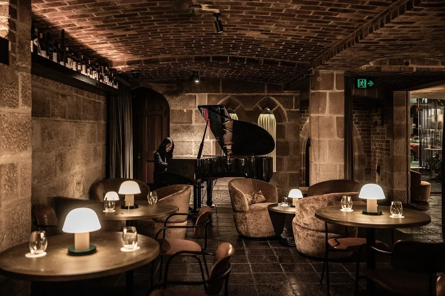 Beckett's Sydney restaurant interior with live piano music, and intimate dining tables.