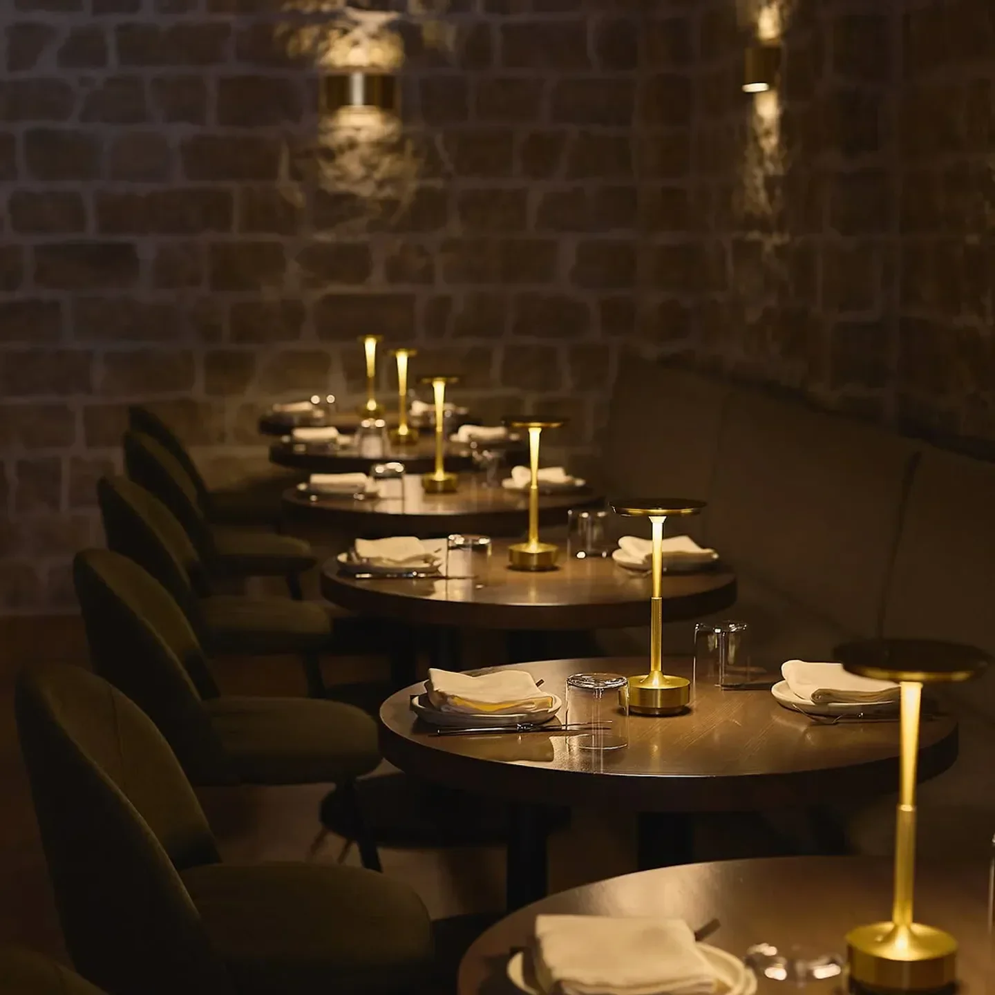 Cozy dining area at Beity Chicago, featuring elegant table settings and warm lighting.
