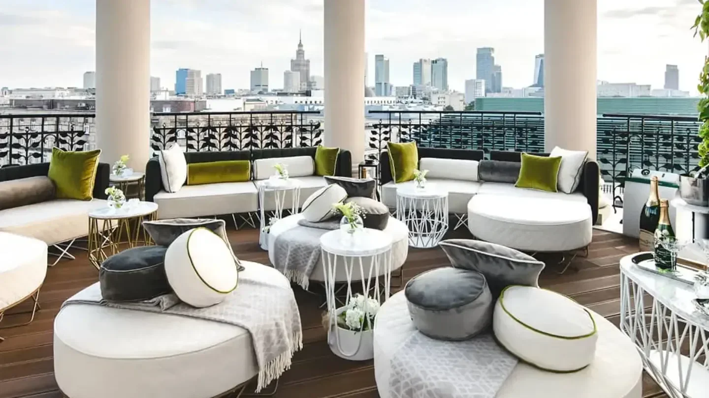Rooftop lounge at Belle Epoque restaurant in Warsaw with city skyline views.