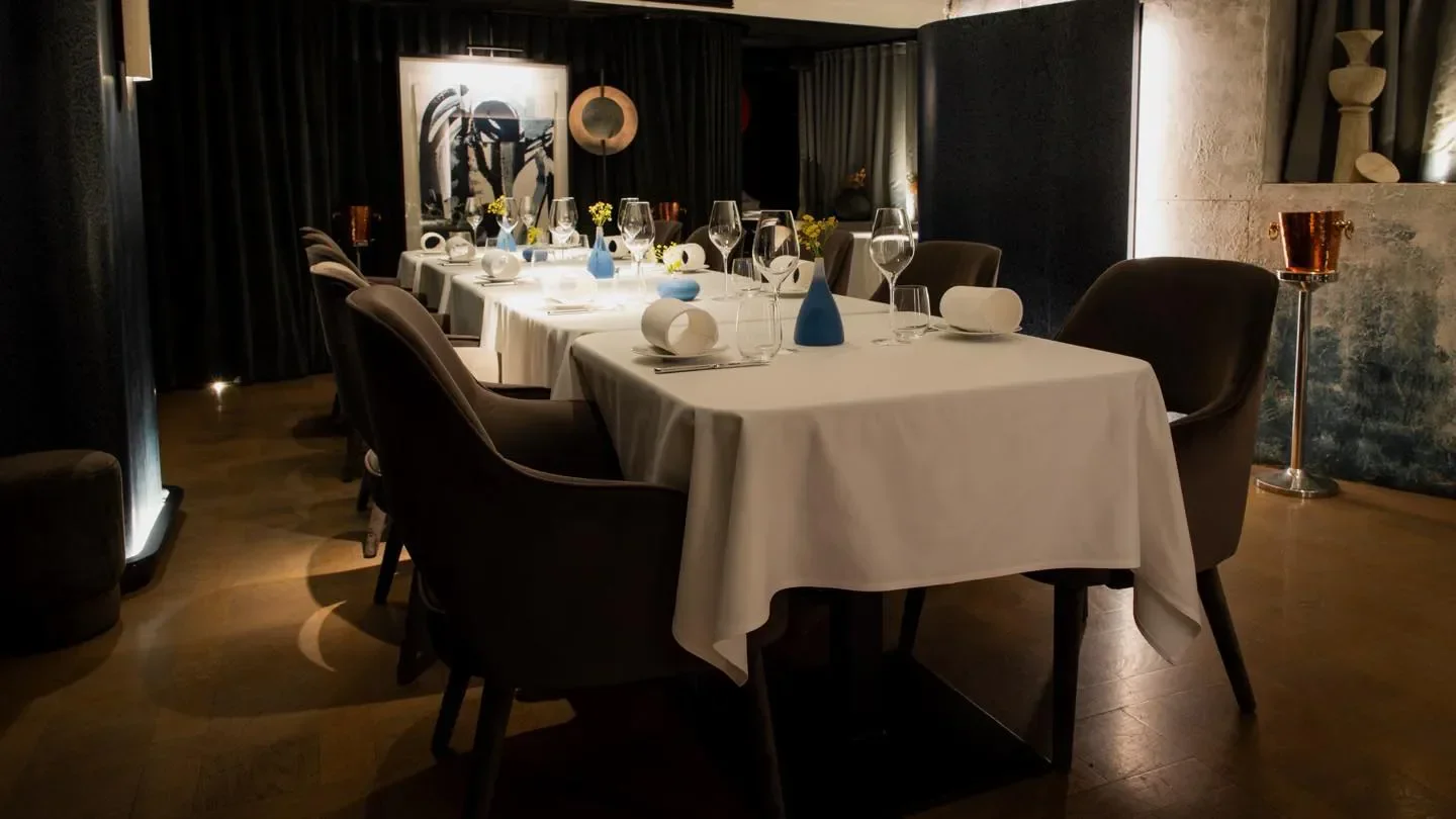 Elegant dining at Belon restaurant in Hong Kong, featuring sophisticated table settings.