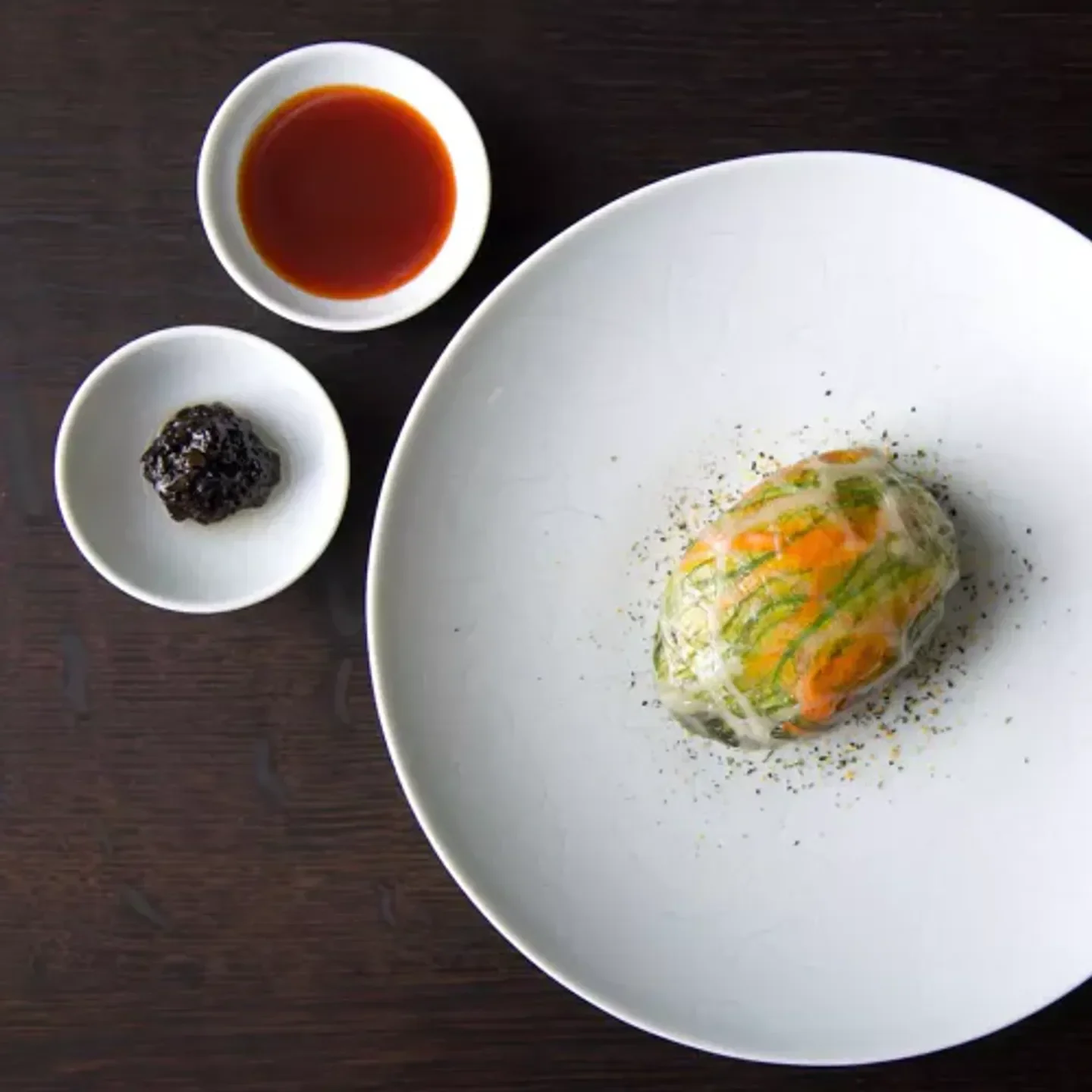 Delectable dish at Benu in San Francisco, featuring elegant presentation and small sauces.