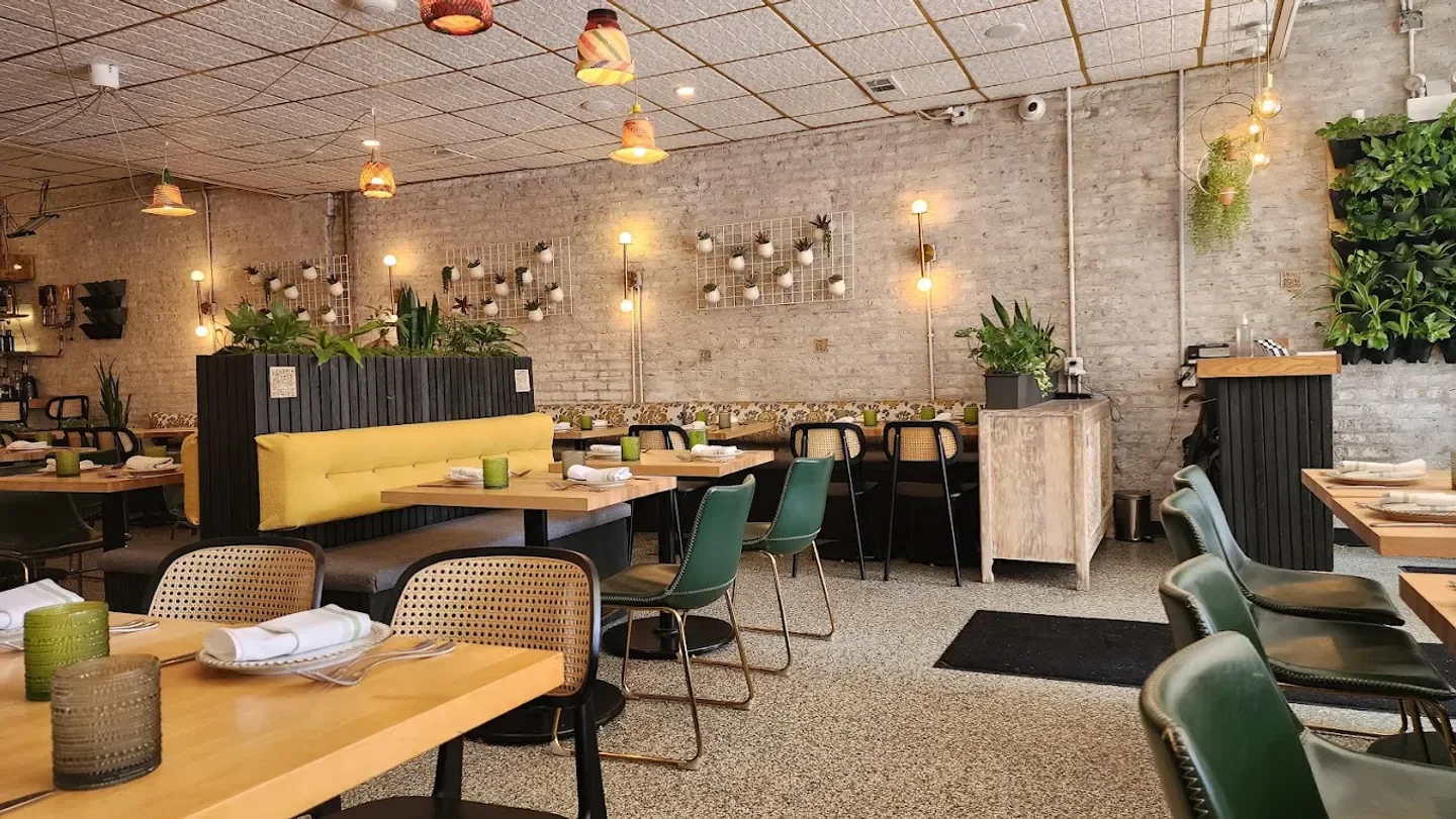 Interior of Bloom Plant Based Kitchen in Chicago with stylish decor and seating.