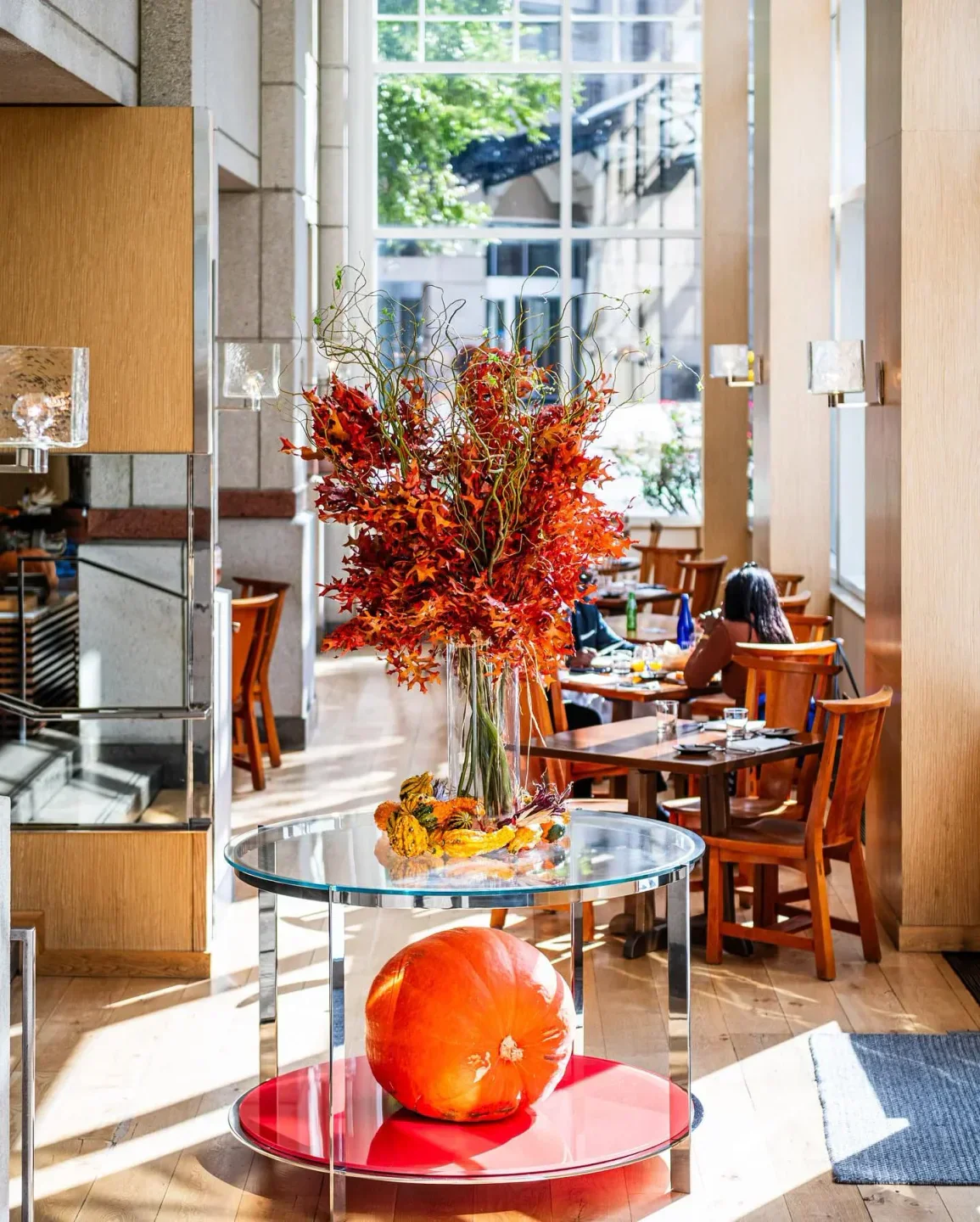 Elegant dining interior at Blue Duck Tavern in Washington, with seasonal decorations.