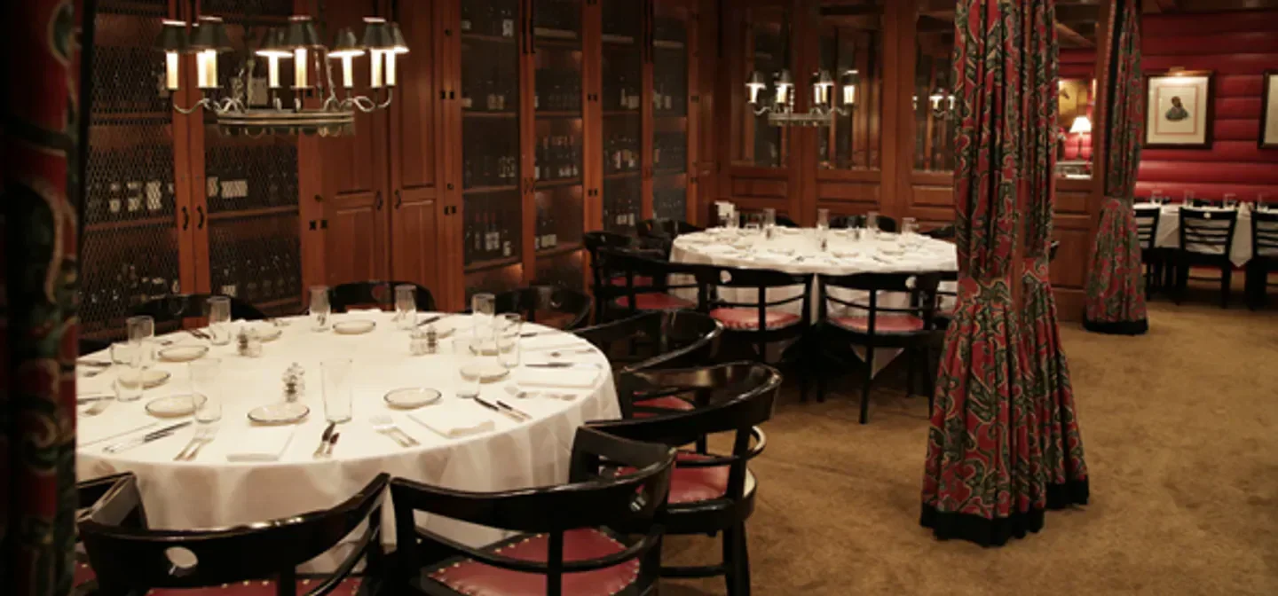 Elegant dining room interior at the Blue Ridge Grill in Atlanta, with tables set