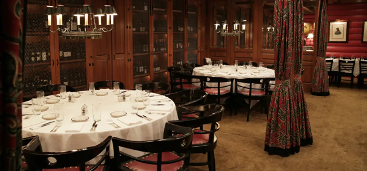 Elegant dining room interior at the Blue Ridge Grill in Atlanta, with tables set