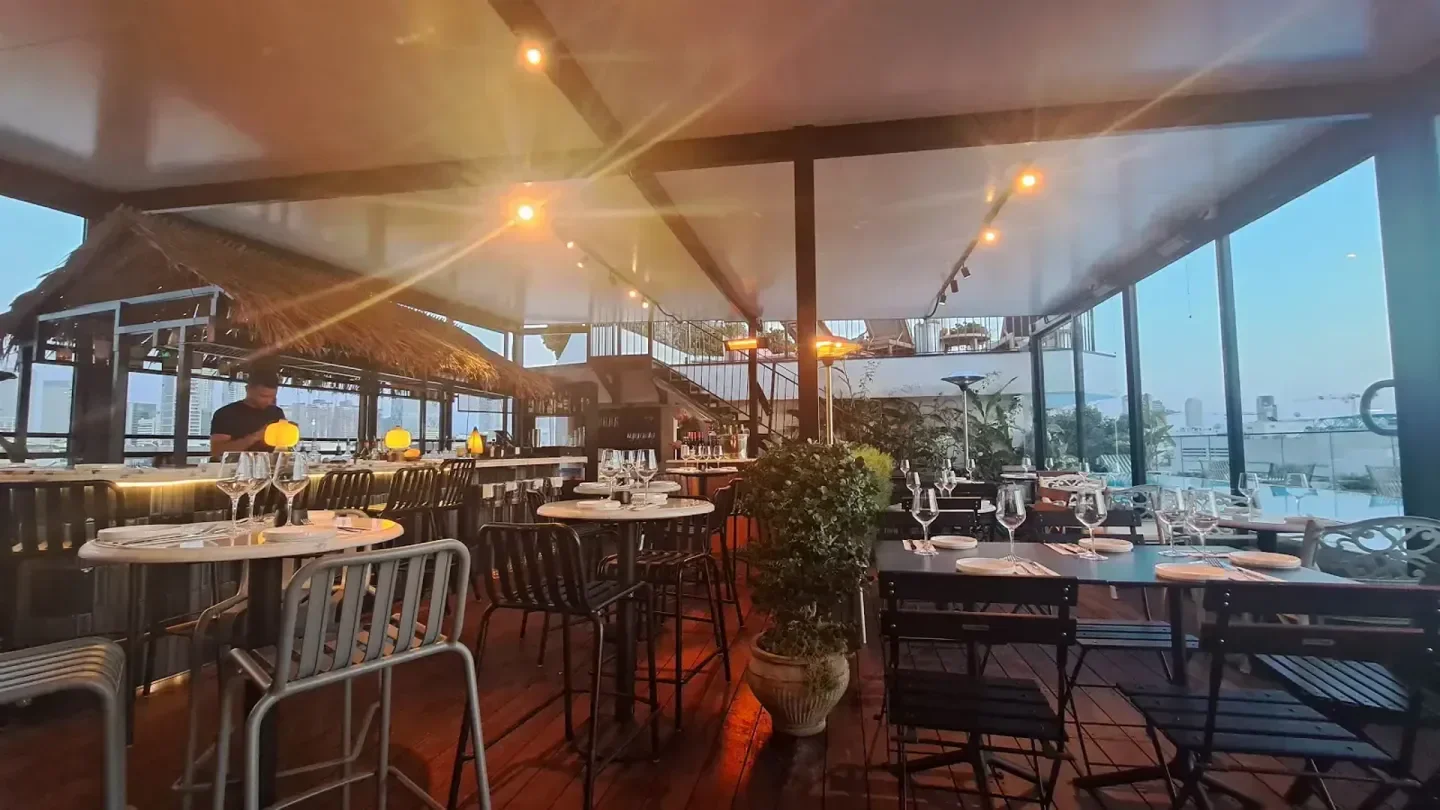 Rooftop dining at Blue Sky in Tel Aviv, with elegant table settings and city views