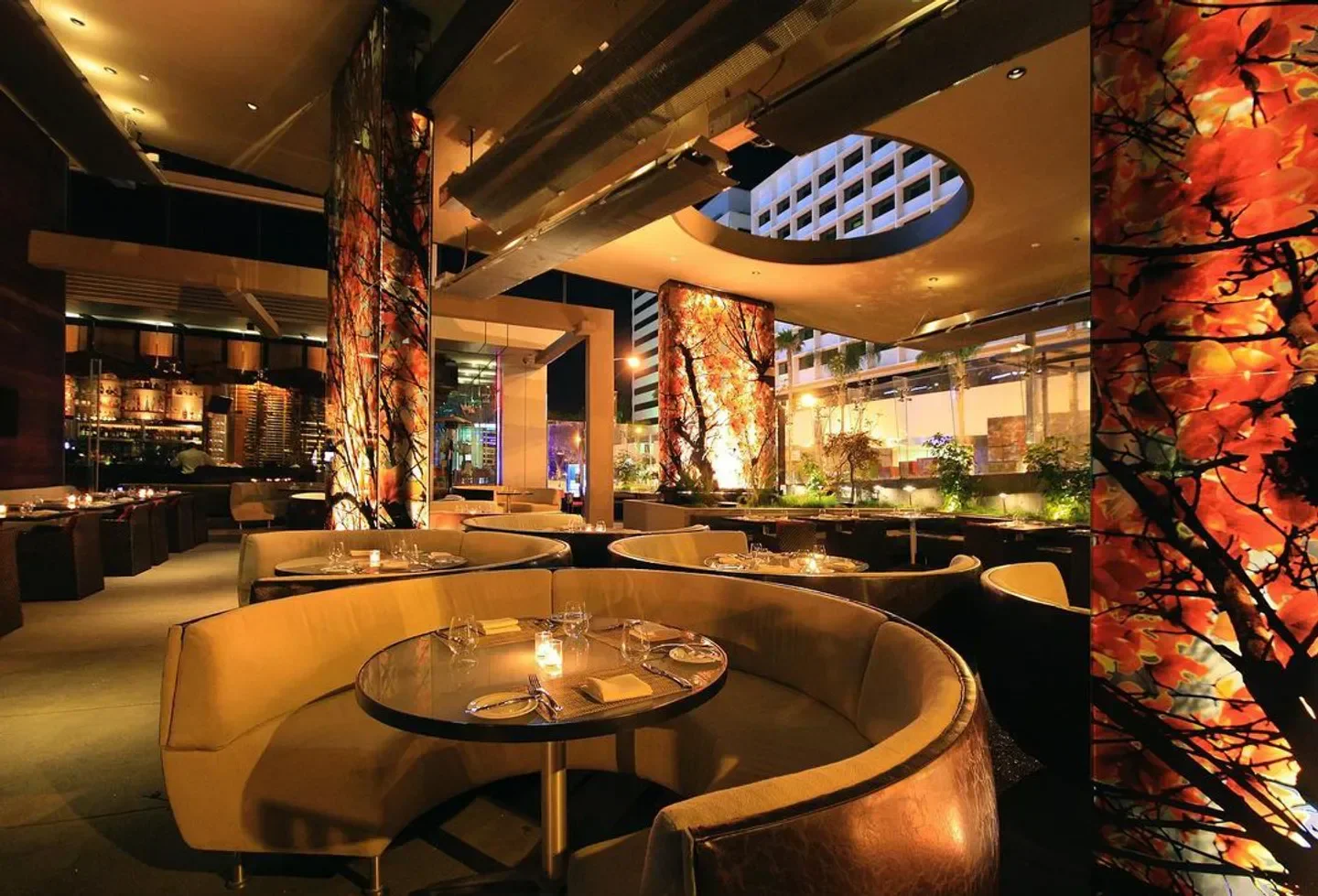 Interior of BOA Steakhouse in Los Angeles with stylish booths and decorative pillars