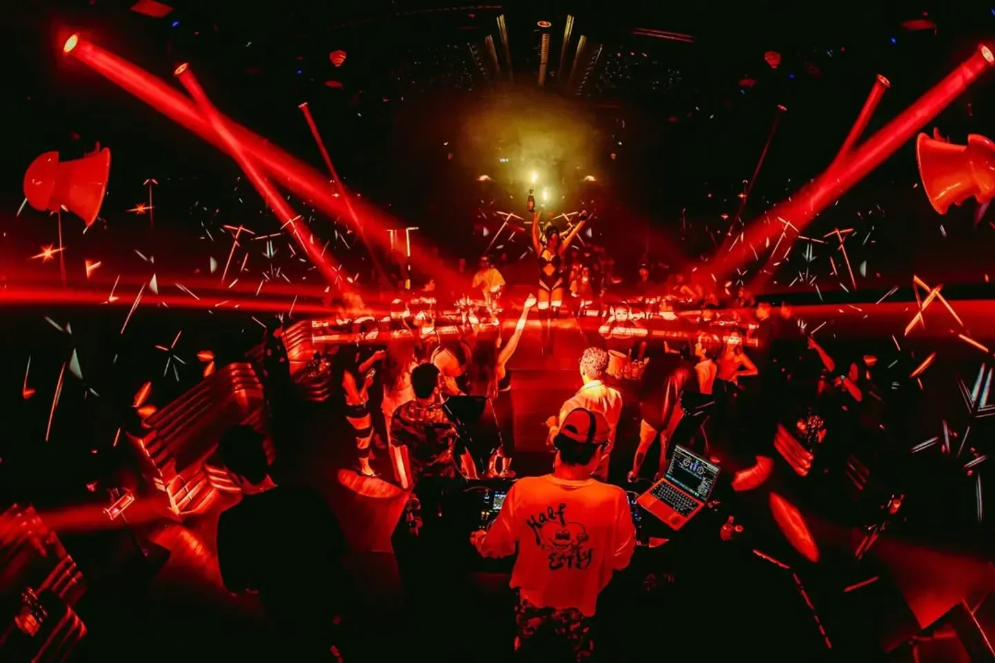 Energetic night at Bobo Club Bangkok with red lights and party atmosphere in Bangkok.