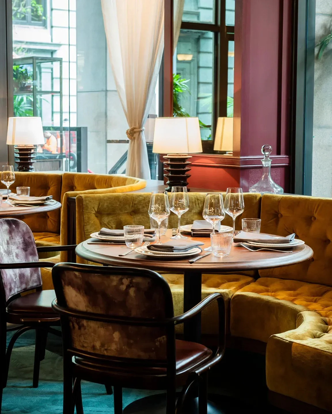 Cozy dining area inside Bopp & Tone restaurant in Sydney with velvet seating and tables