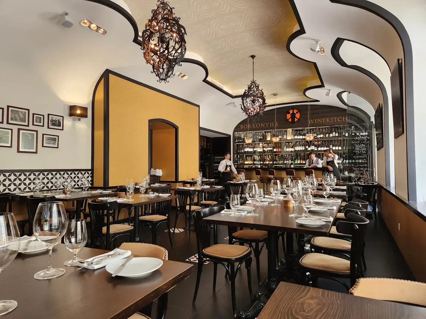 Elegant interior of Borkonyha Winekitchen in Budapest, showcasing dining area and bar.