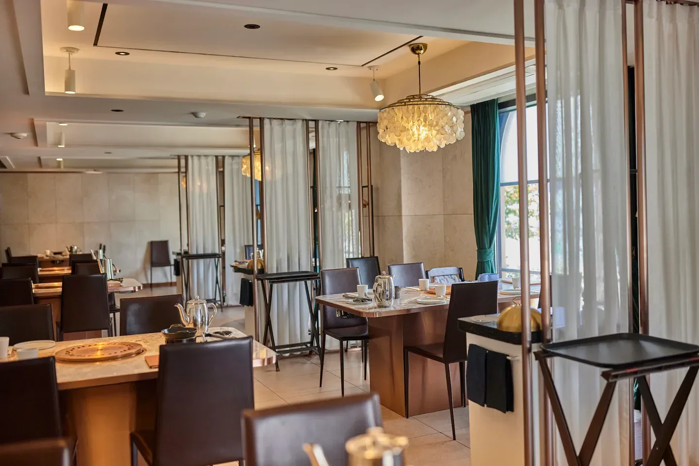 Interior dining at Born & Bred restaurant in Seoul, with elegant tables and decor.