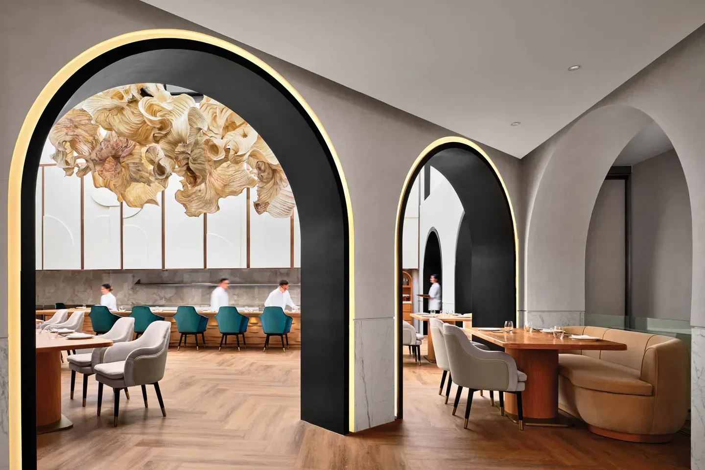 Interior of BORN restaurant in Singapore, featuring unique archways and decor.