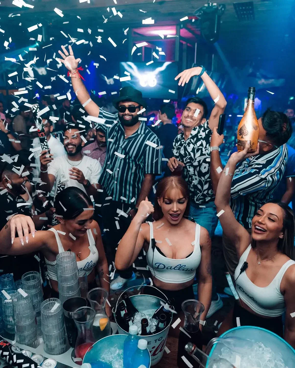 Confetti celebration at Bottled Blonde Dallas nightclub, people enjoying the party atmosphere