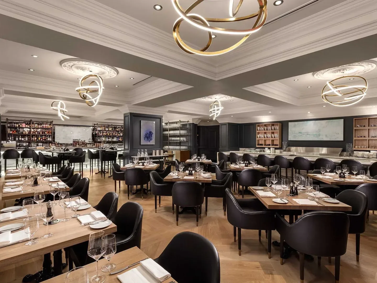 Elegant interior of Boulevard restaurant in Vancouver with stylish lighting and dining tables.