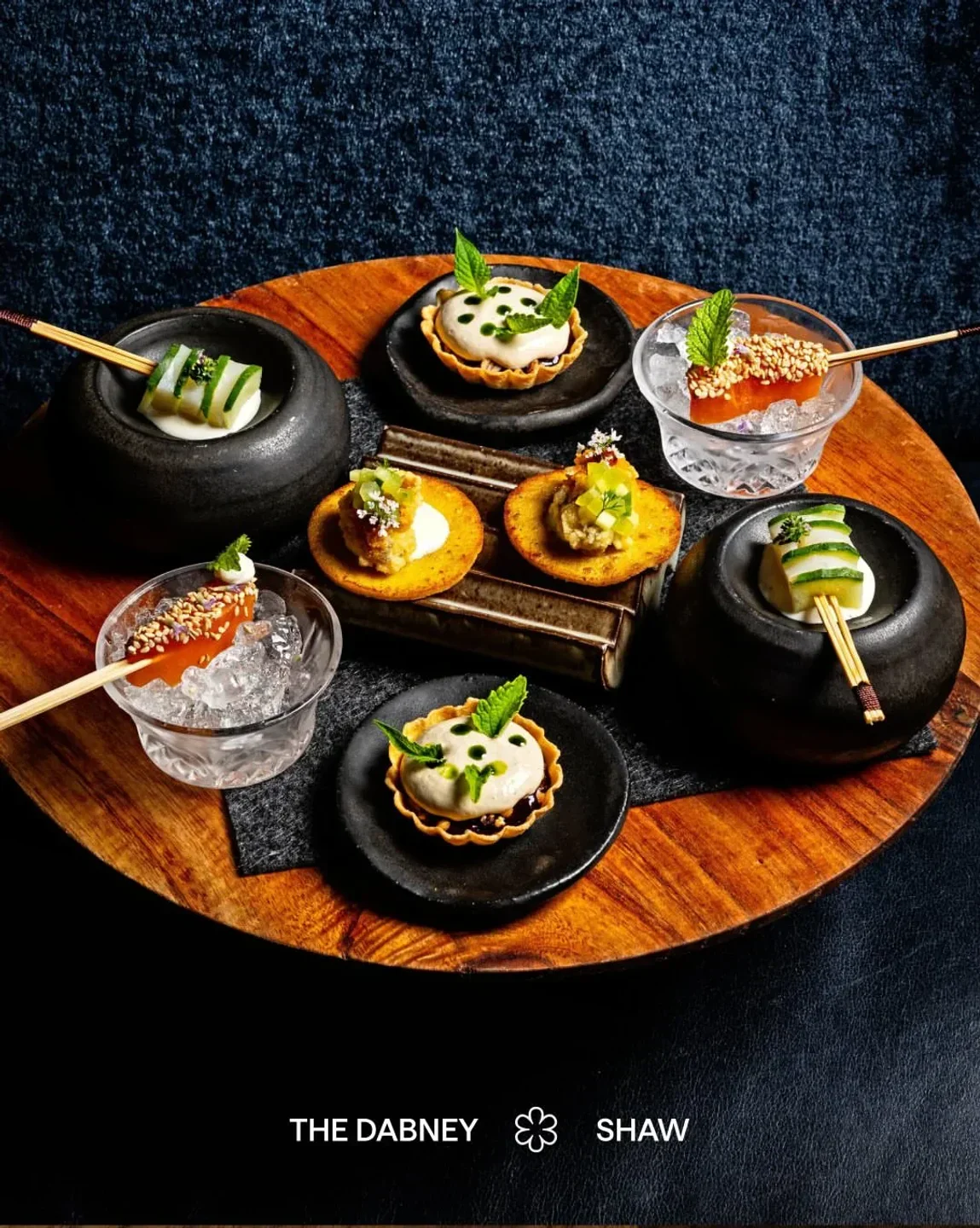Delectable small plates at Bresca restaurant in Washington, beautifully arranged on a wooden platter.