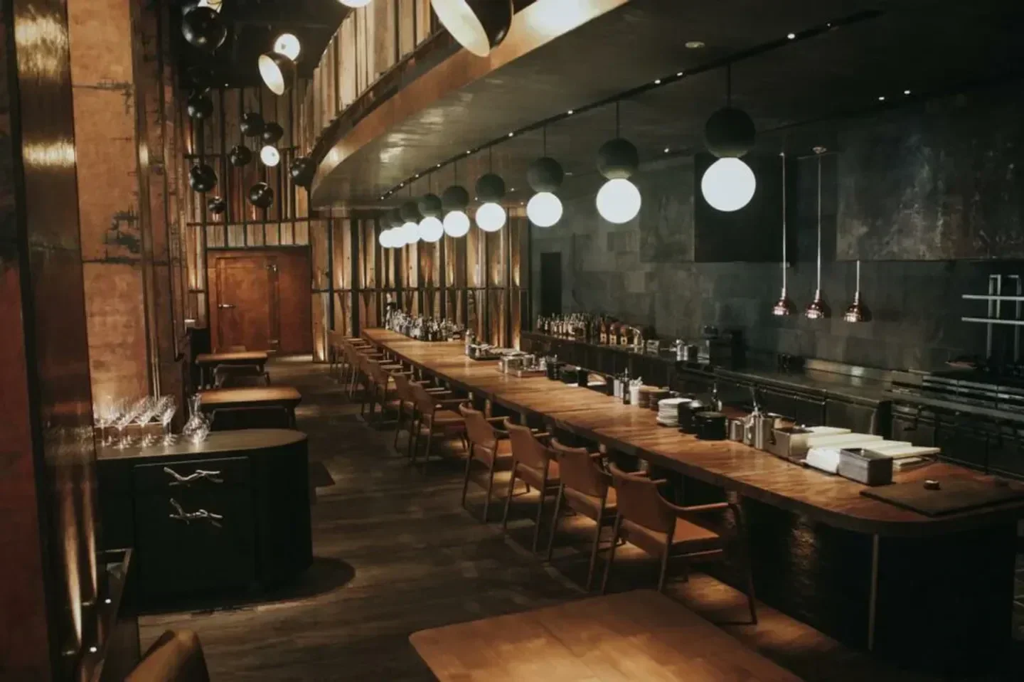 Interior view of Burnt Ends restaurant in Singapore with stylish lighting and bar seating