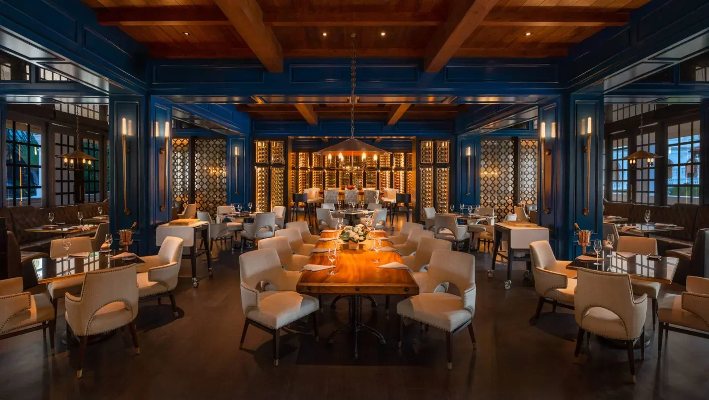 Butcher's Block in Singapore: Elegant dining room with long table and wine displays