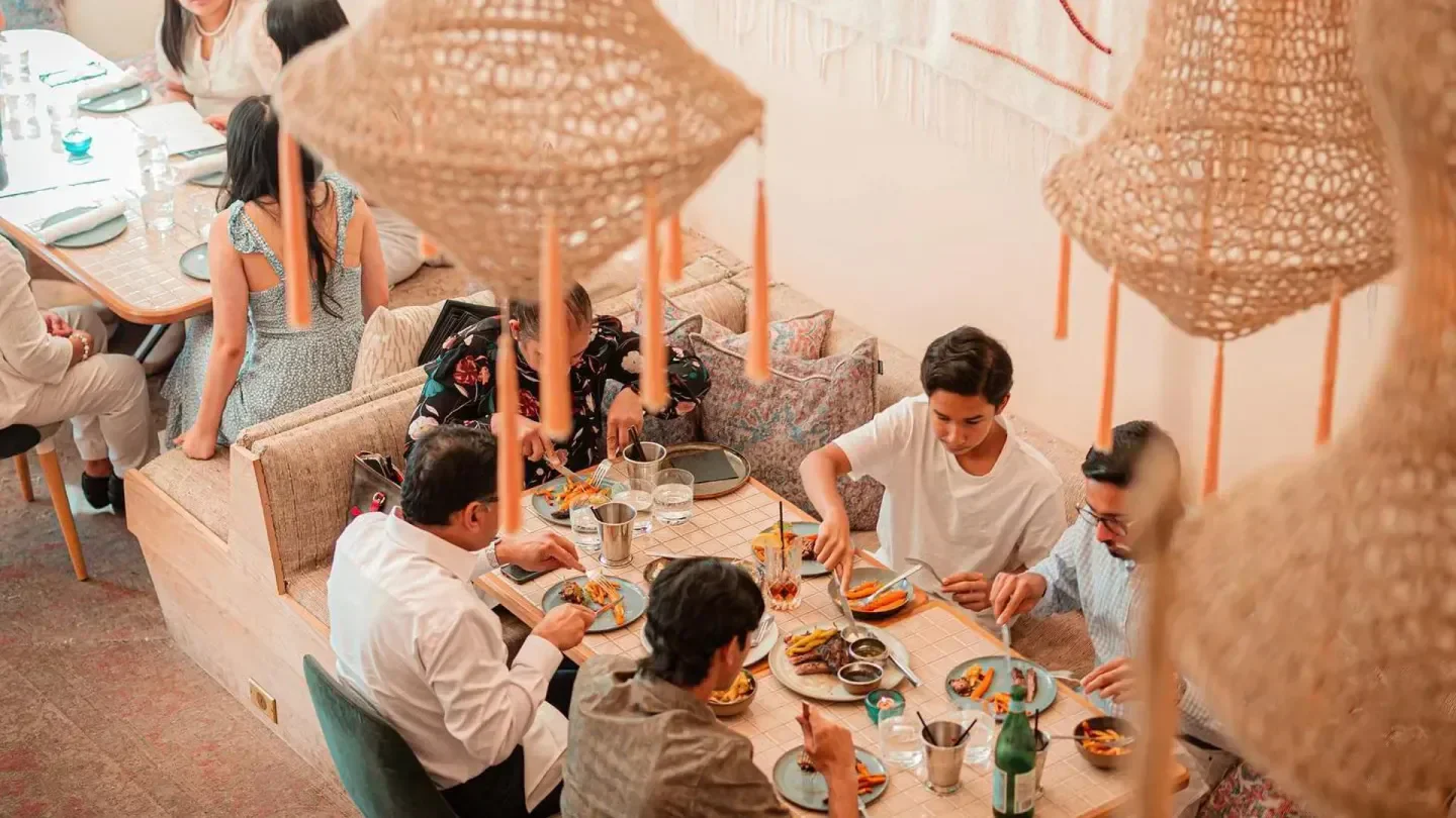 Dining at Byblos Toronto restaurant with stylish decor and delicious looking food.
